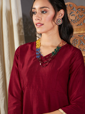 Maroon Zari Embroidered Peplum Top-Shae by SASSAFRAS